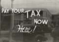 a sign that says pay your tax now here